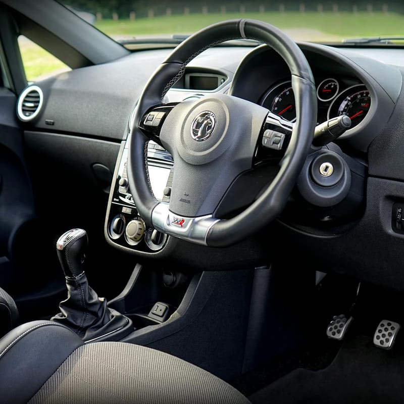Cockpit detail — steering wheel and dash
